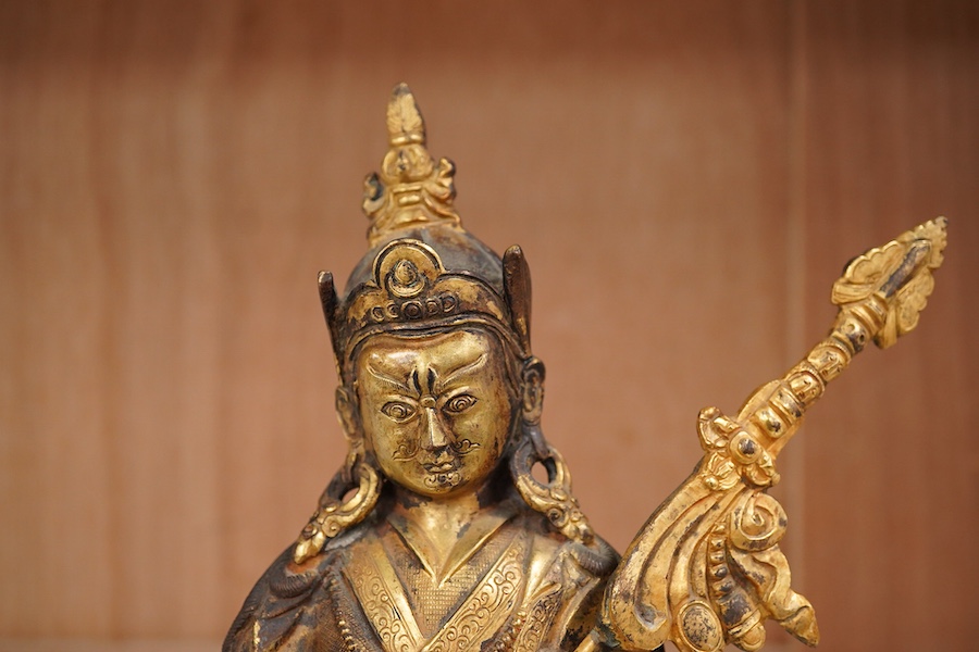 A gilt bronze figure of Padmasambhava, 22cm